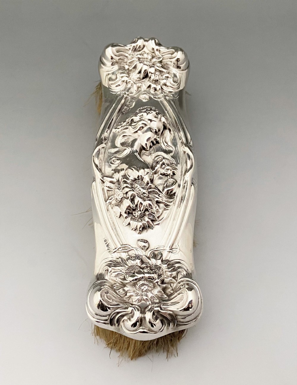 A fabulous Art Nouveau silver clothes brush
