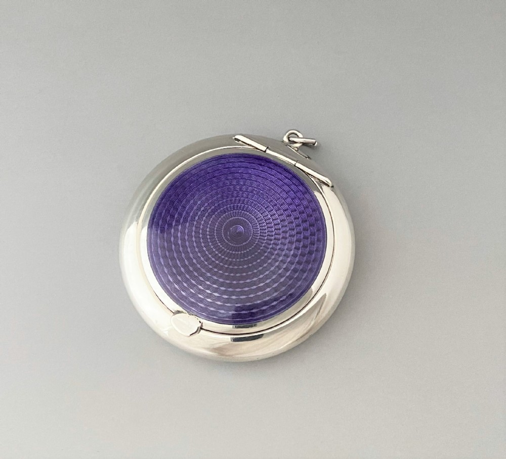 A fabulous Art Deco silver & guilloche enamel compact