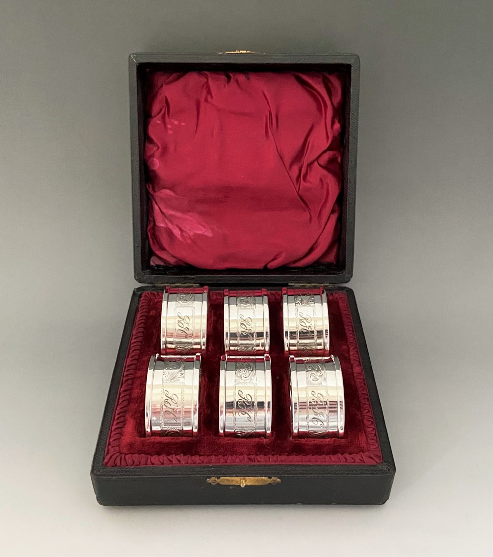 A desirable set of six boxed silver napkin ring