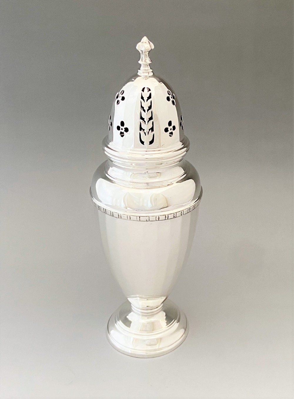 A stylish Art Deco silver sugar caster