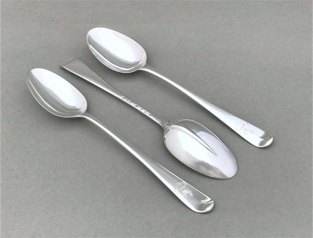 A rare set of three 18th Century silver dessert spoons