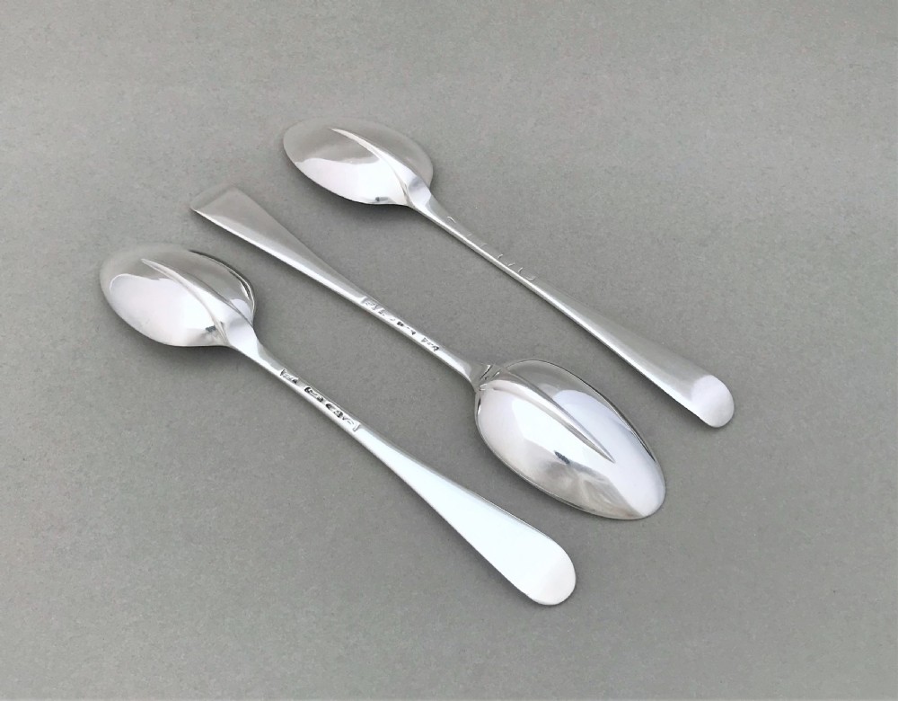 A rare set of three 18th Century silver dessert spoons View II