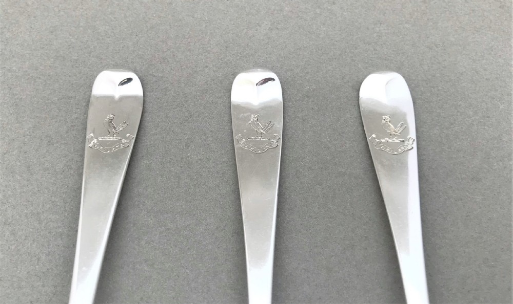A rare set of three 18th Century silver dessert spoons View III