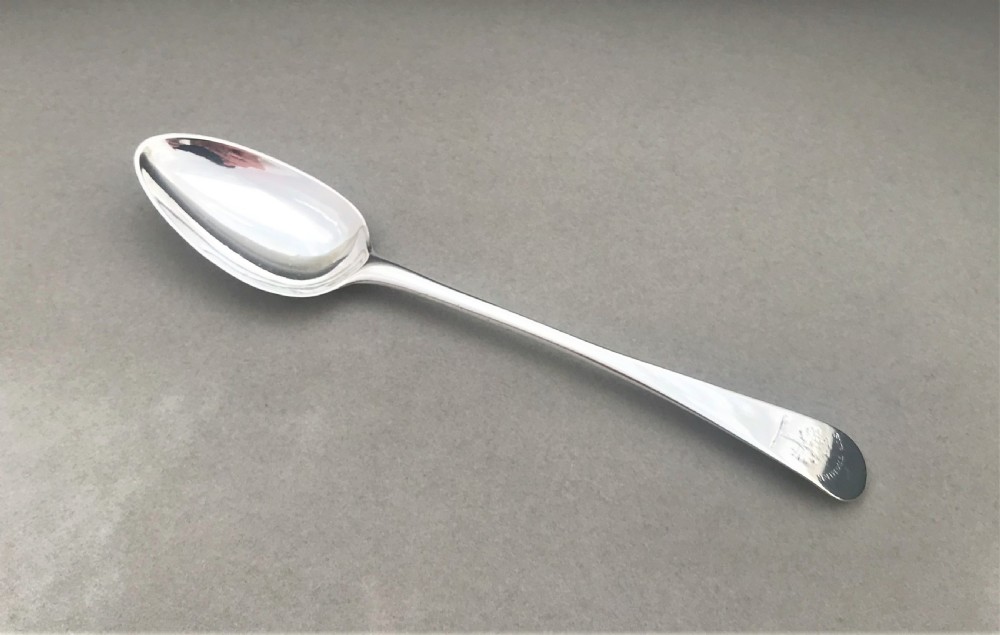 A rare set of three 18th Century silver dessert spoons View V