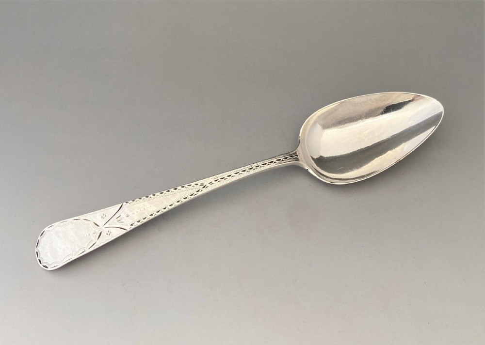 A bright cut Exeter silver table or serving spoon View II
