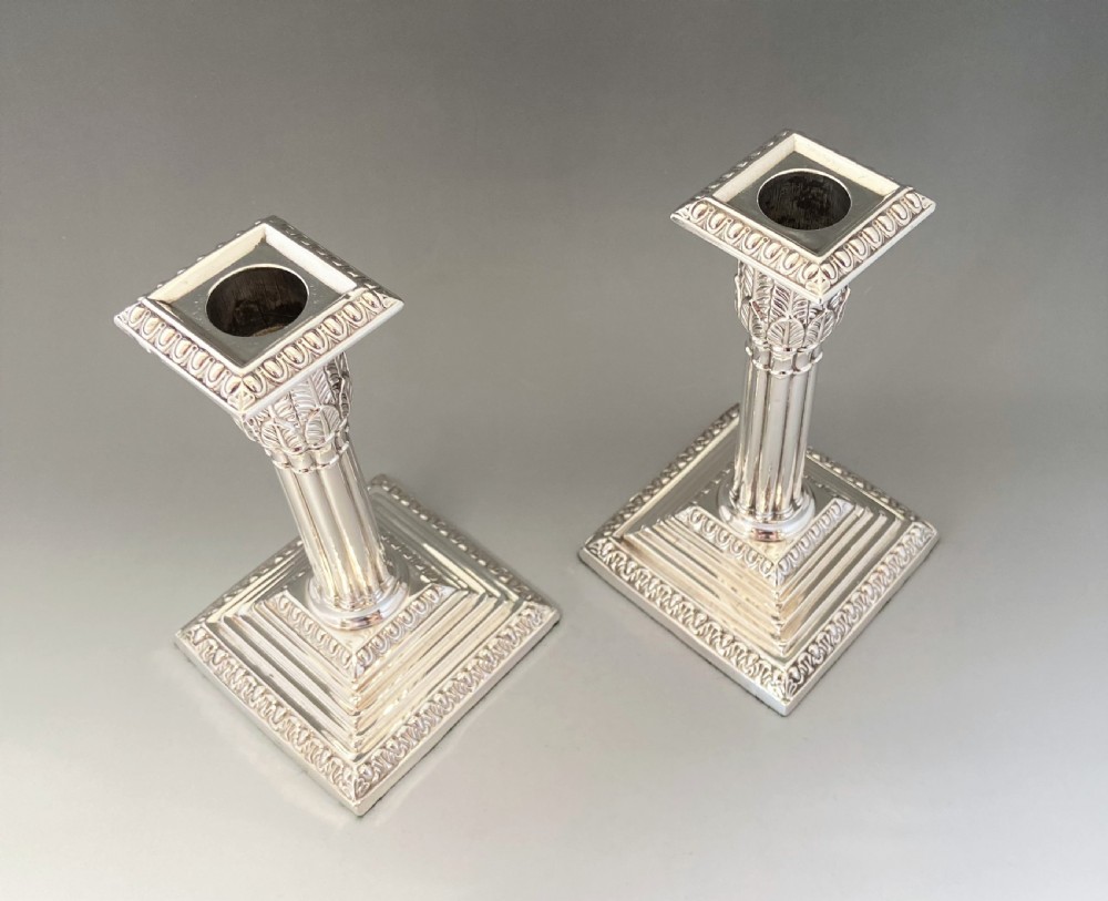 A stunning pair of late Victorian silver candle sticks View II