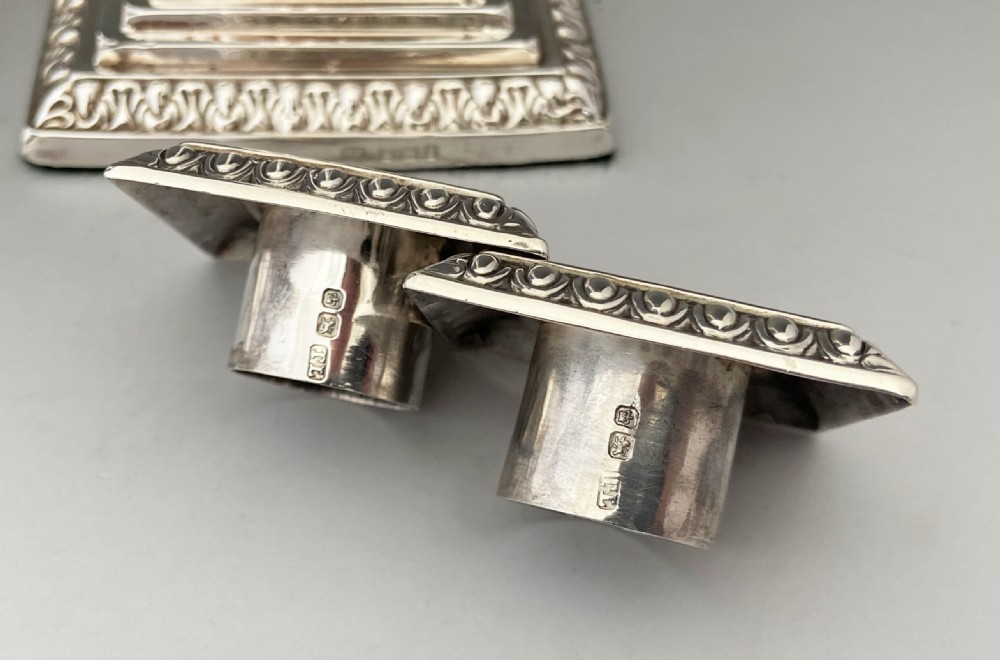 A stunning pair of late Victorian silver candle sticks View V