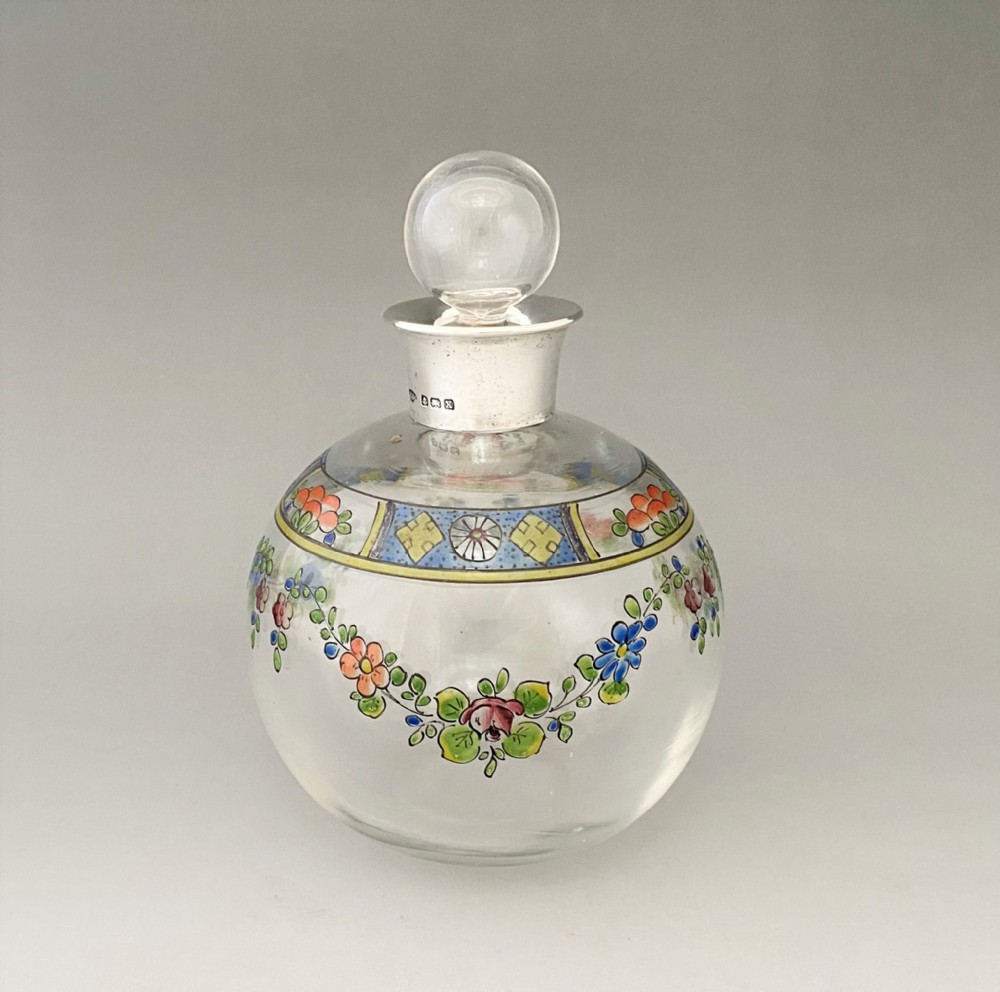 A lovely silver mounted globe cologne bottle