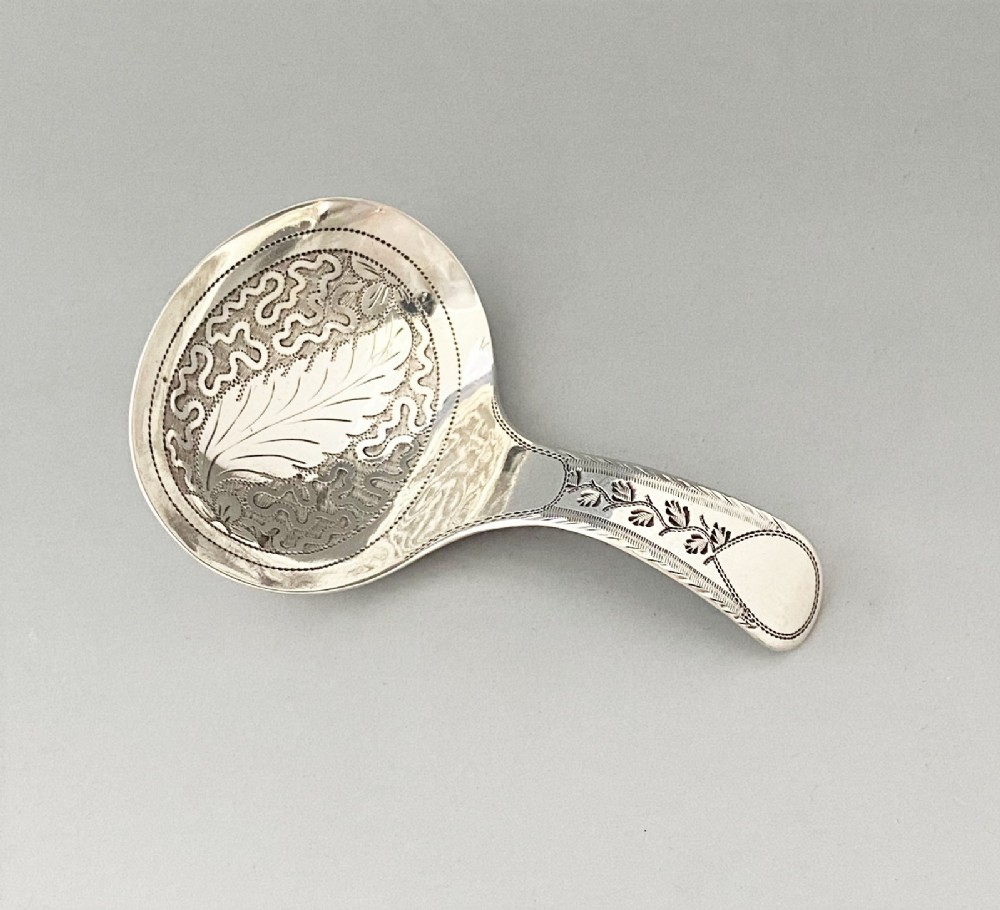 An unusual Bright cut Georgian silver caddy spoon