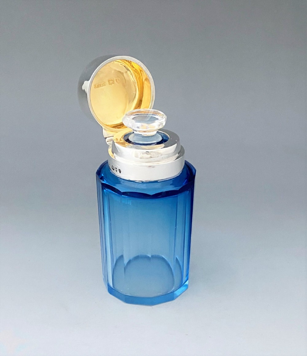 An unusual silver mounted scent bottle