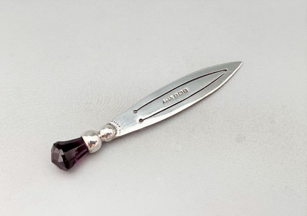 A lovely silver bookmark with an amethyst thistle terminal