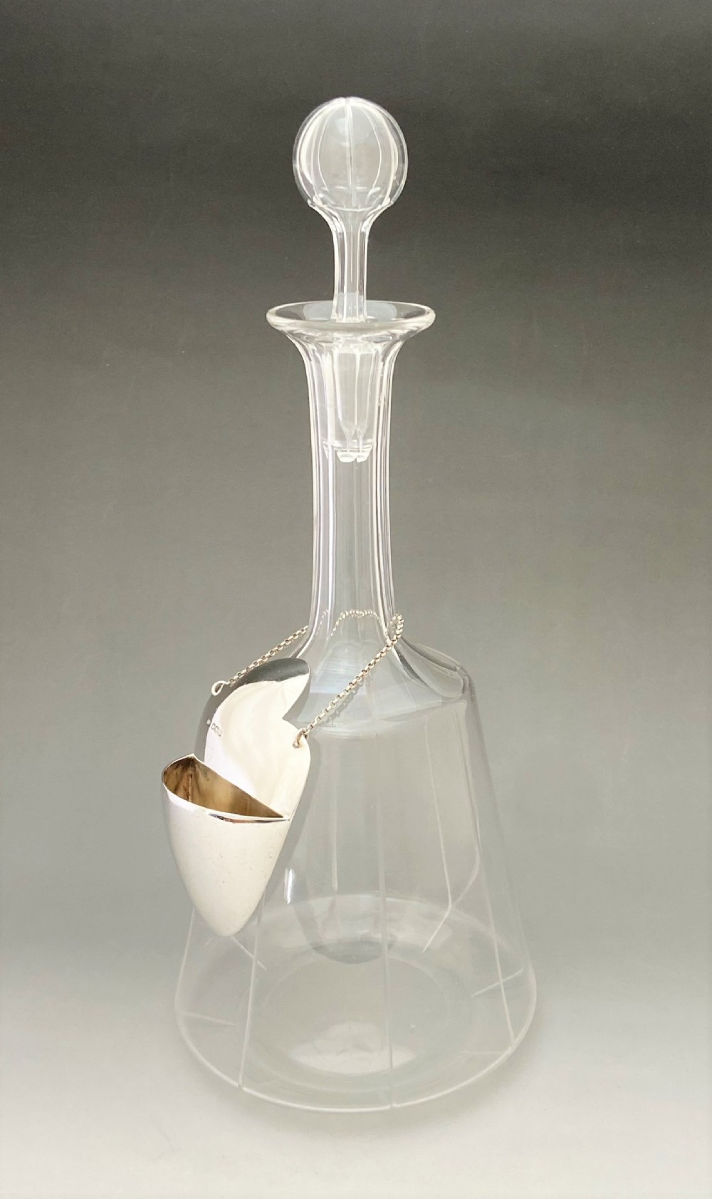 An extremely rare decanter & silver drip catcher
