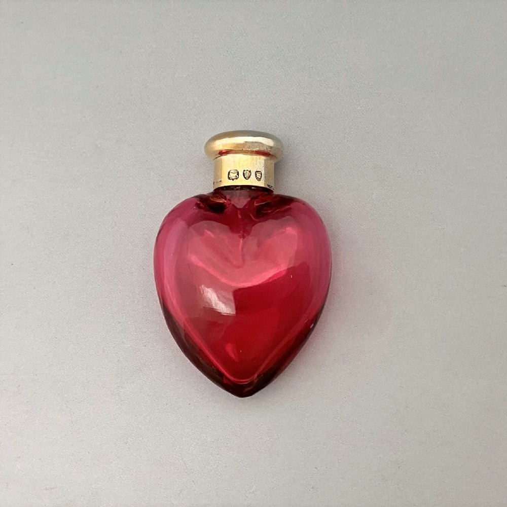 A Victorian Sampson Morden silver mounted heart scent bottle