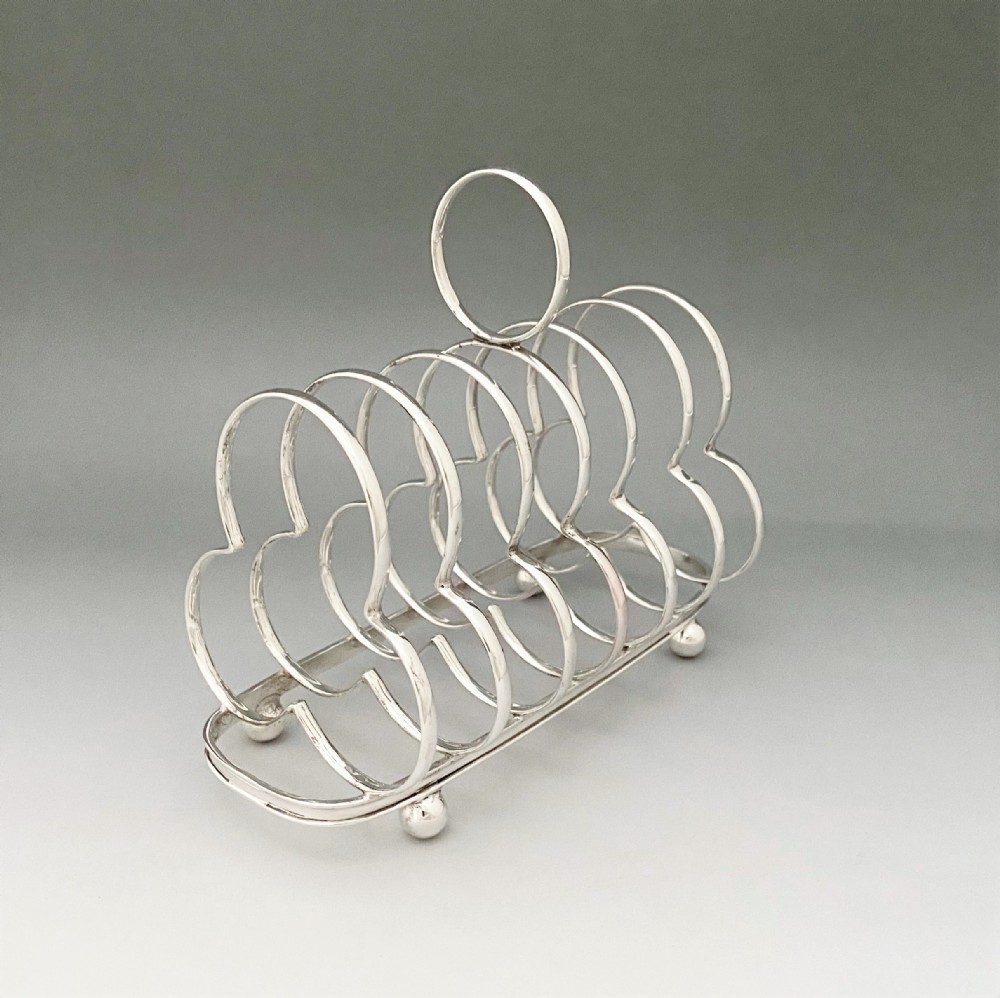 A handsome Edwardian silver toast rack