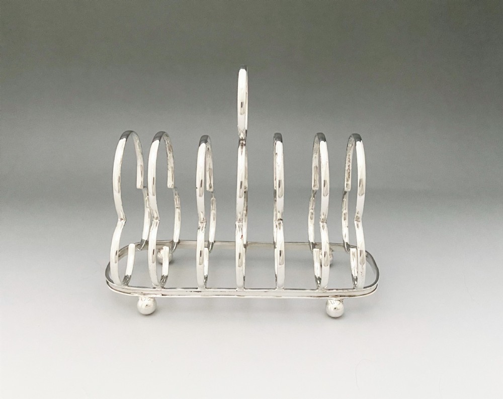 A handsome Edwardian silver toast rack View III