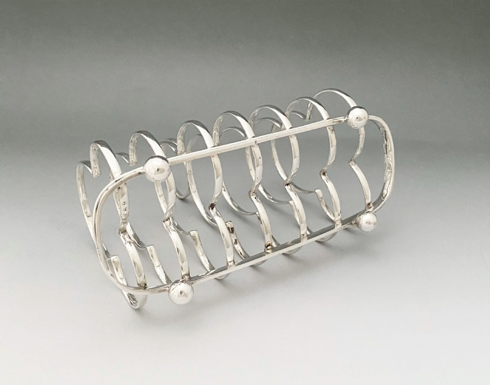 A handsome Edwardian silver toast rack View V