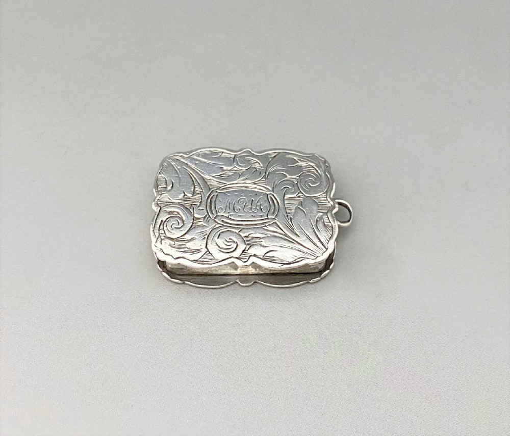 A charming small early Victorian silver vinaigrette