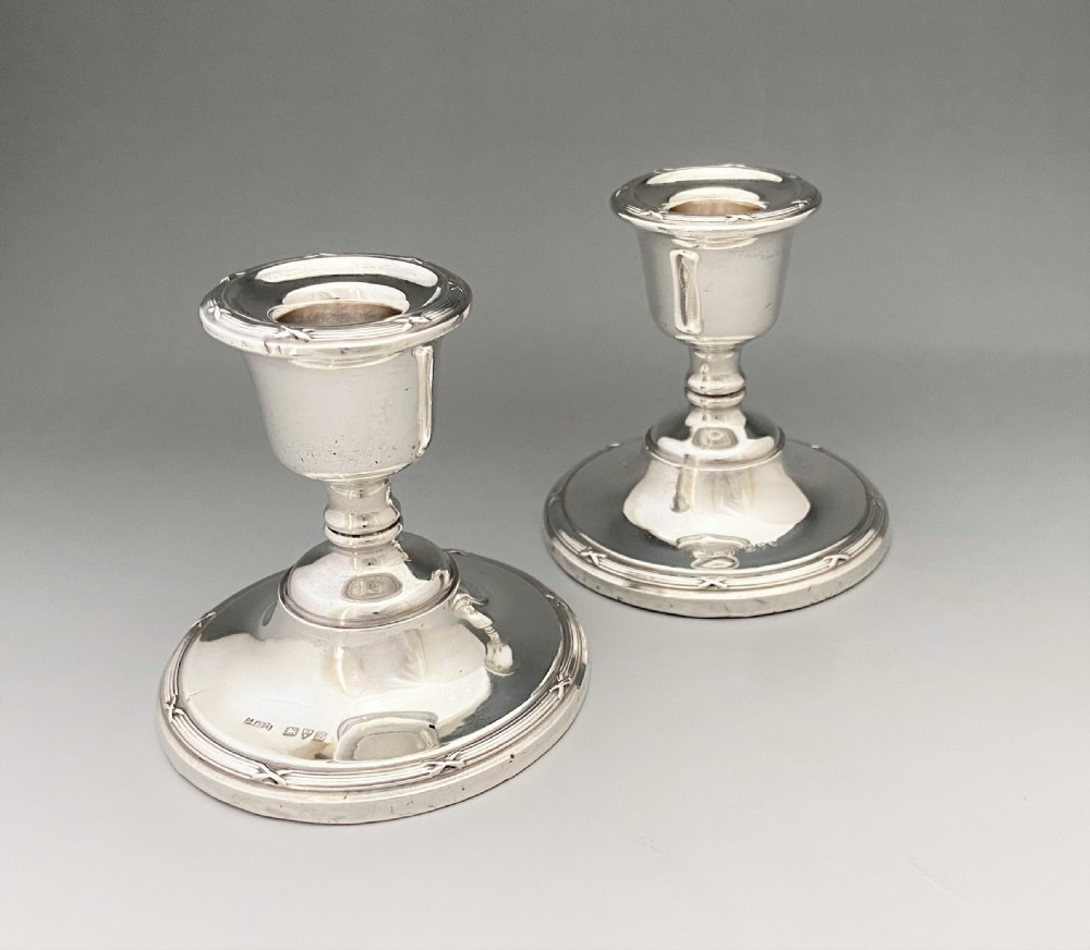 A lovely pair of Chester silver dwarf candlesticks View II