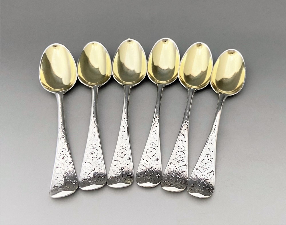 A superb set of 6 mid 18th Century silver gilt teaspoons View V