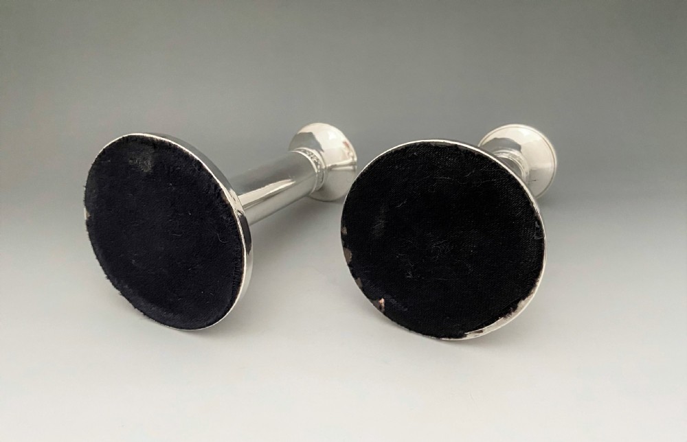 An elegant pair of Edwardian silver candlesticks View V