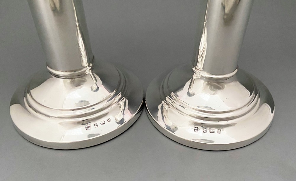 An elegant pair of Edwardian silver candlesticks View VI