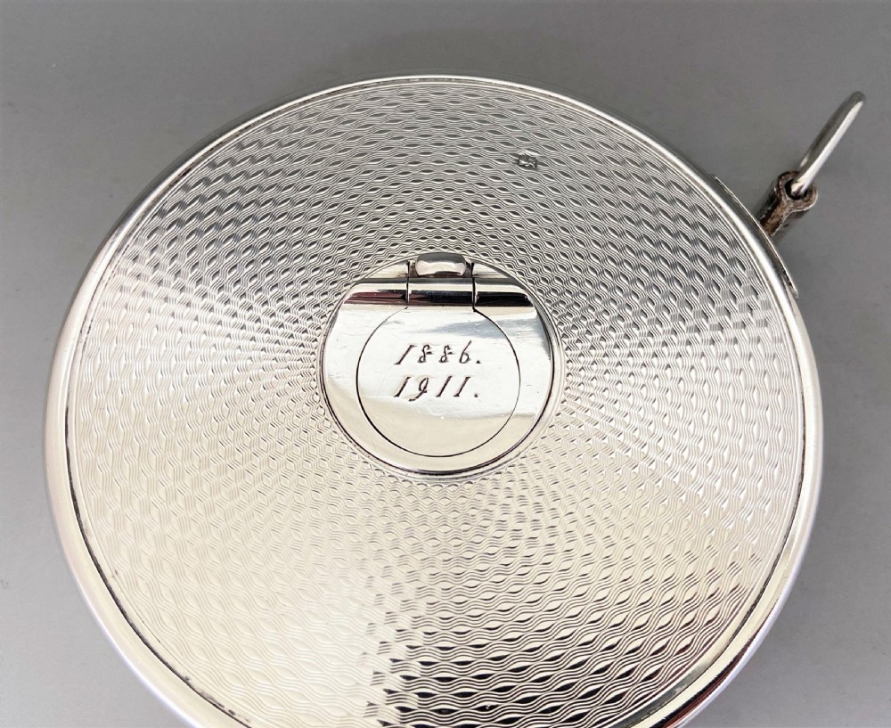 An exceptional silver cased Edwardian tape measure, with Spencer Family provenance View X