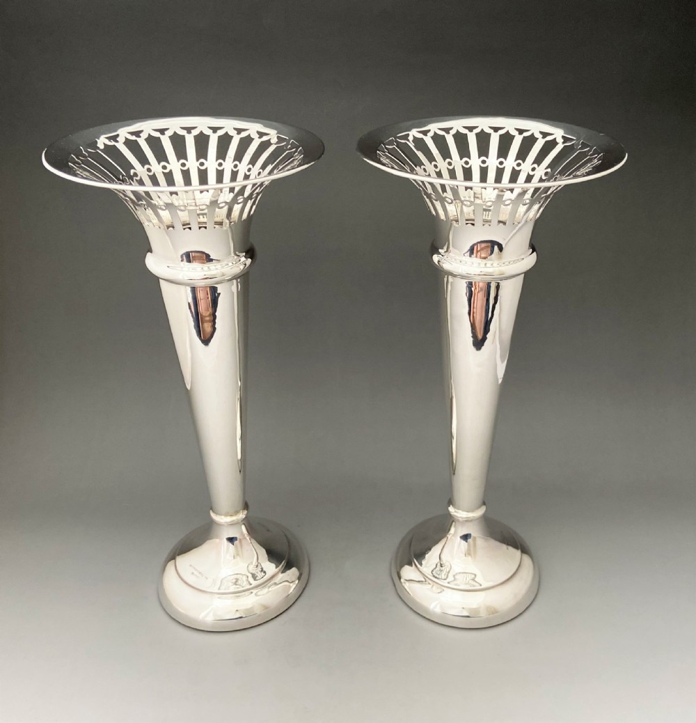 A fabulous pair of large Edwardian silver vases with a Belfast maker