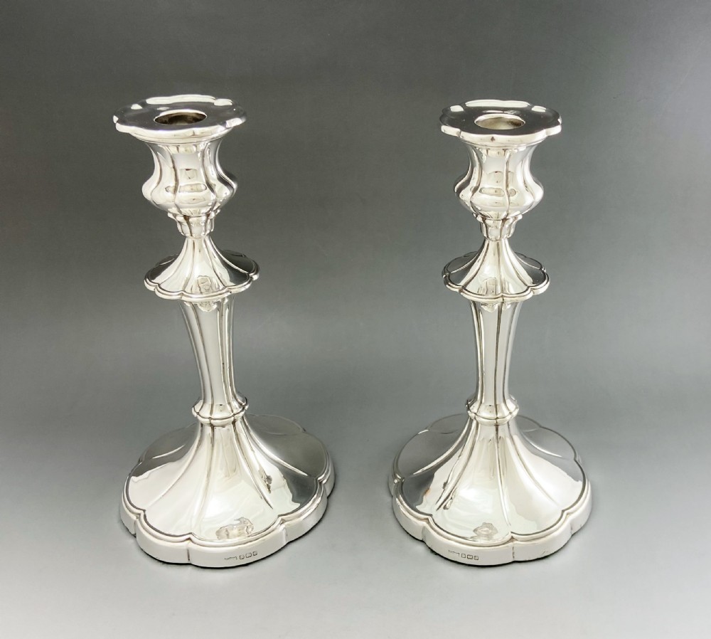 A fabulous pair of full height silver candlesticks