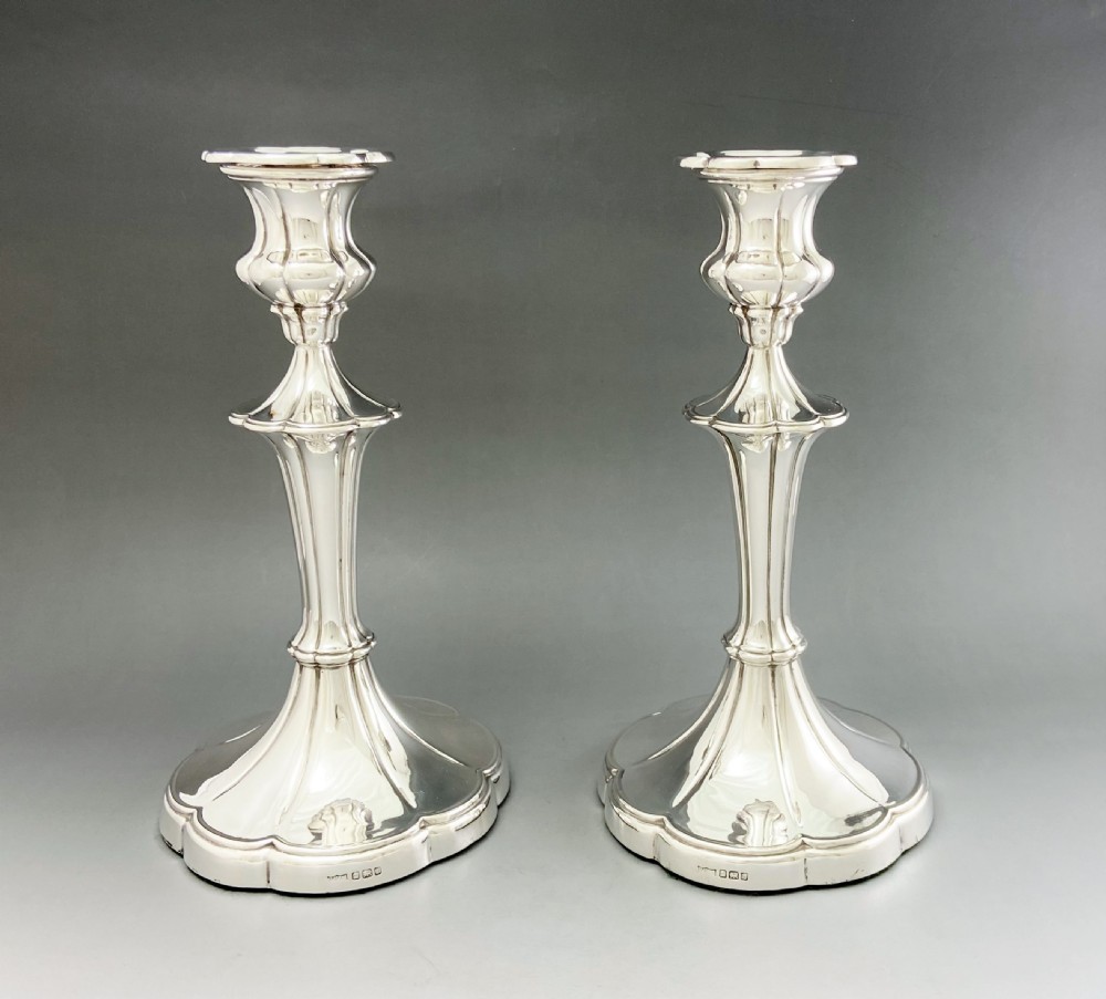 A fabulous pair of full height silver candlesticks View II