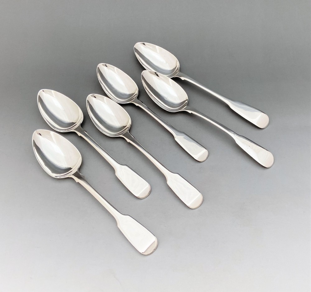 A matched set of six silver Fiddle pattern tea spoons