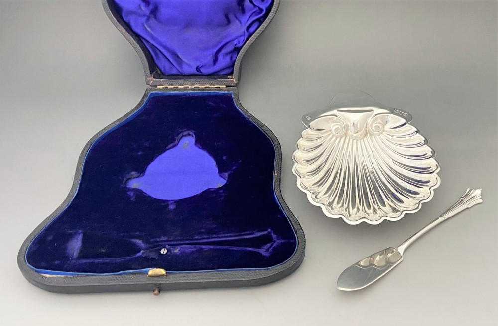 A charming boxed Victorian silver butter shell & knife View VI
