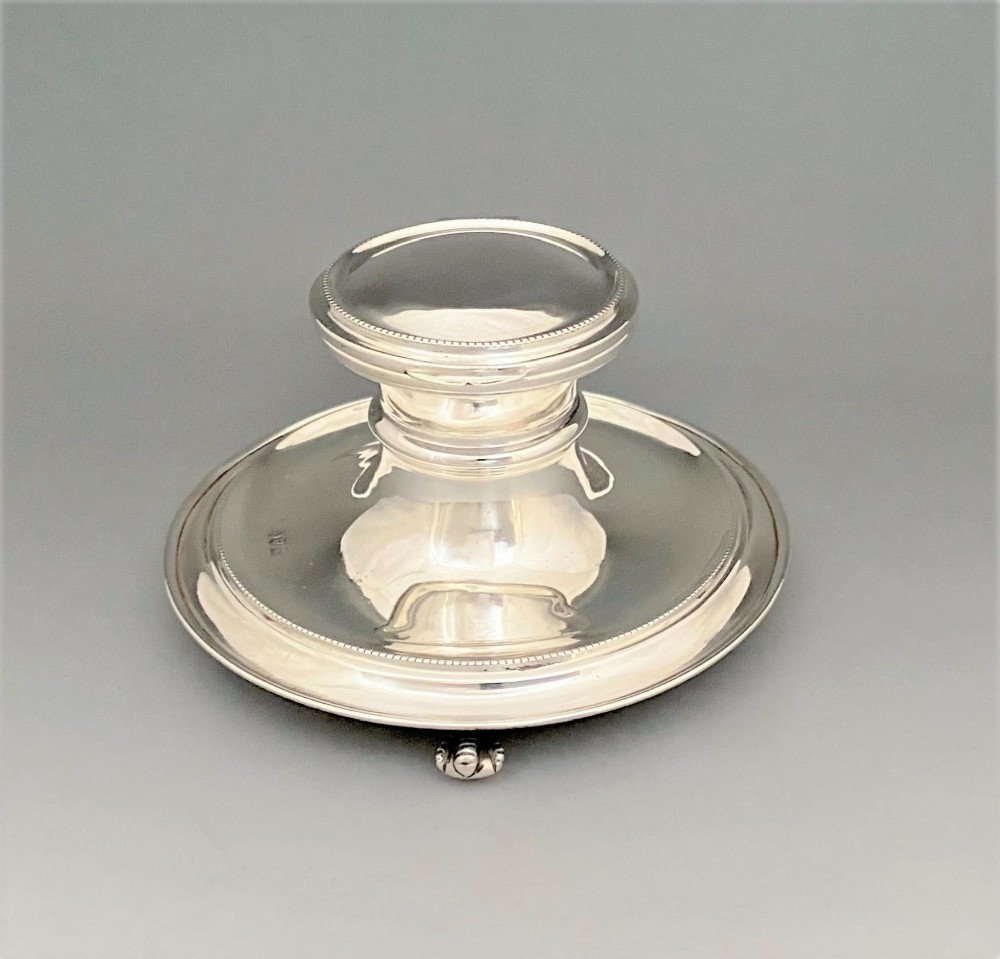 A stylish George V silver capstan inkwell