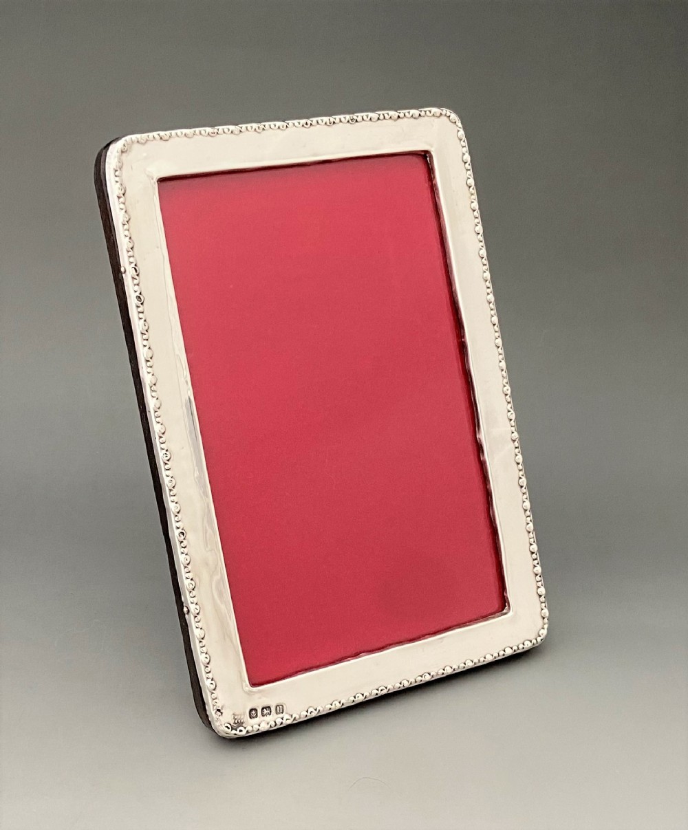 A charming George V silver photo frame