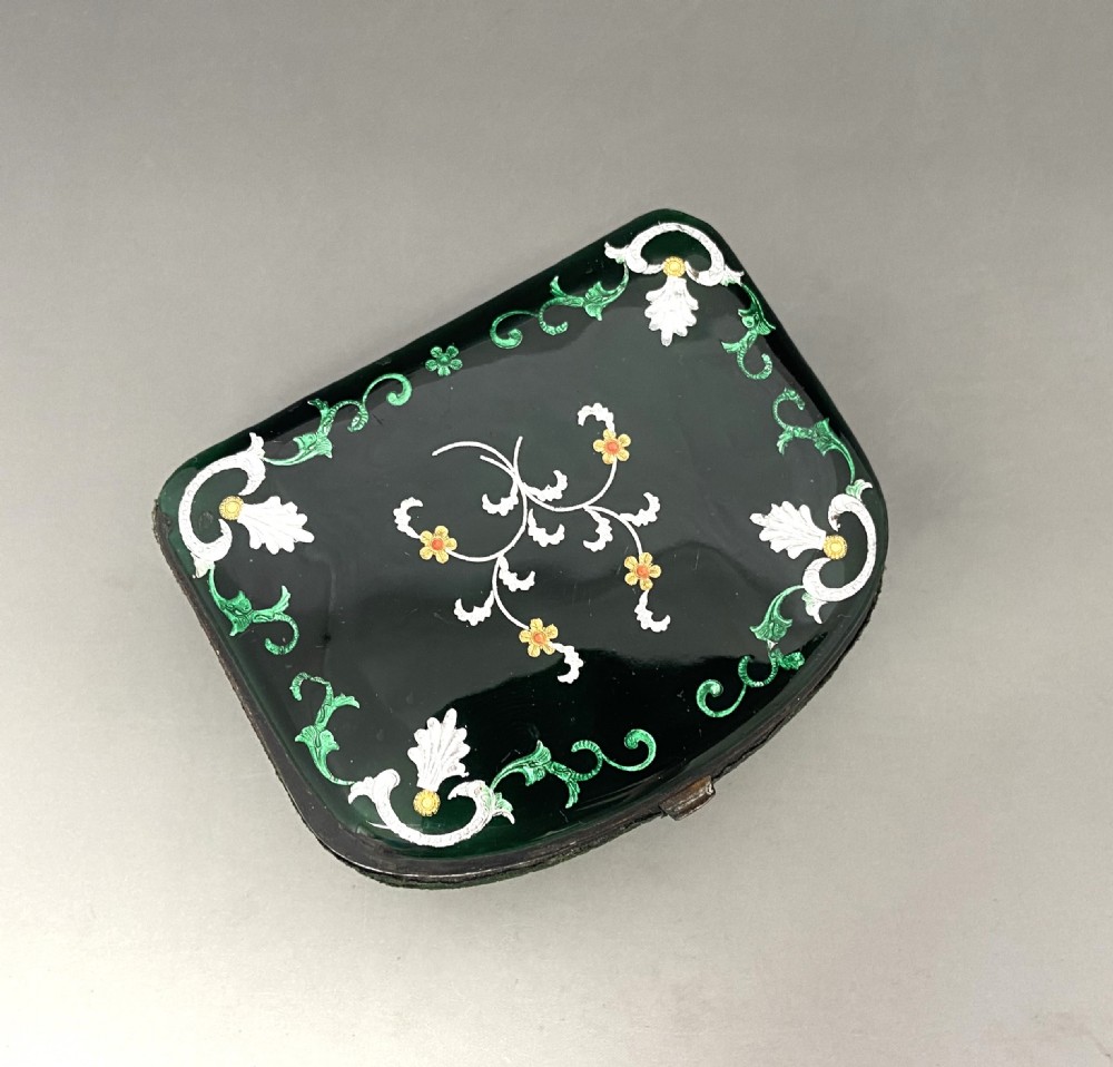 An antique dark green Georgian trinket box featuring a glass lid decorated with white, yellow, and green painted scrollwork motifs. View VII
