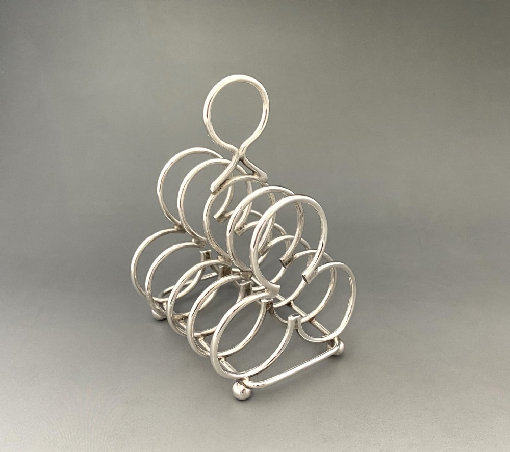 An Attractive Edwardian four slice Silver Toast Rack