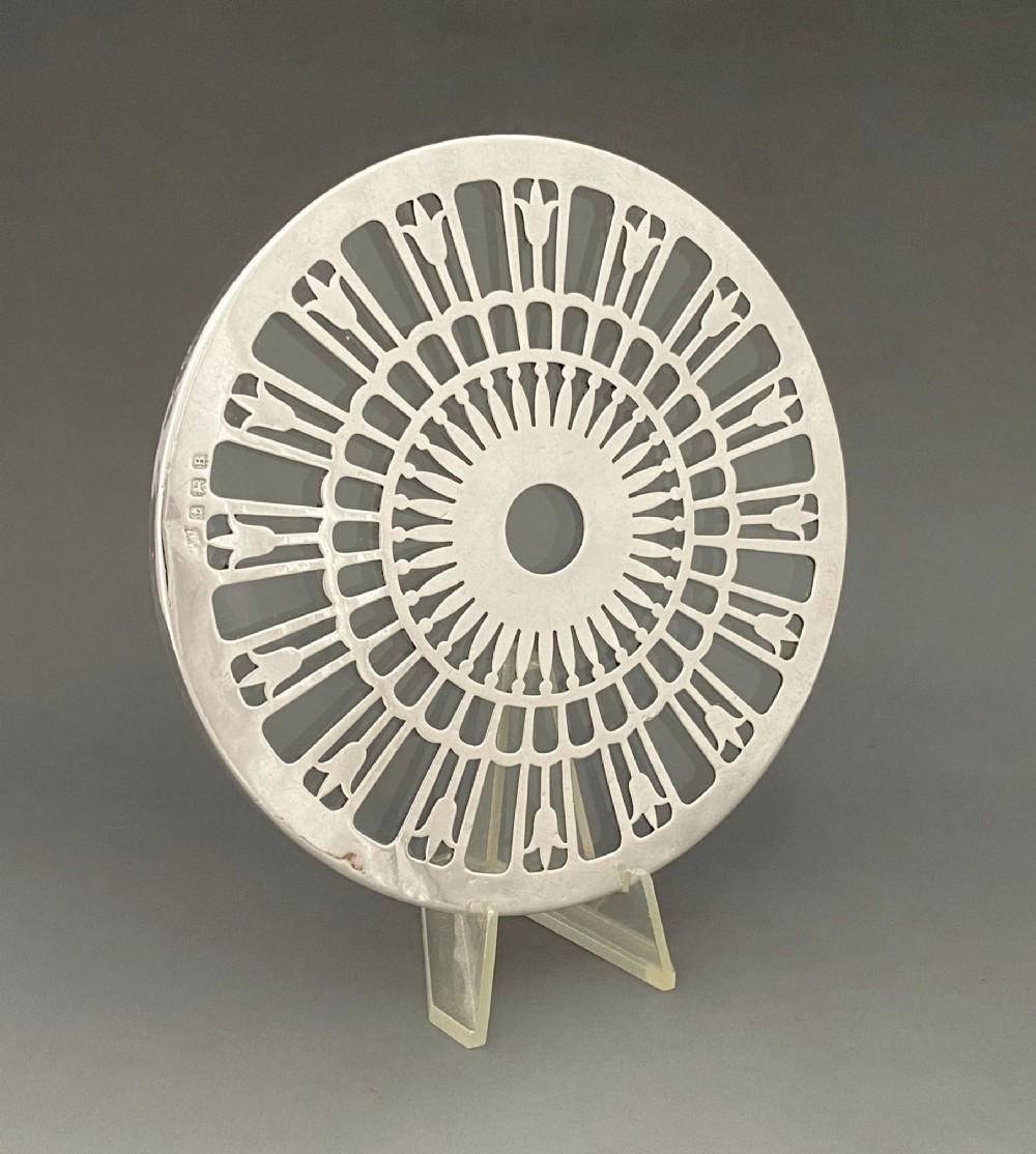 A lovely silver mounted teapot stand/coaster