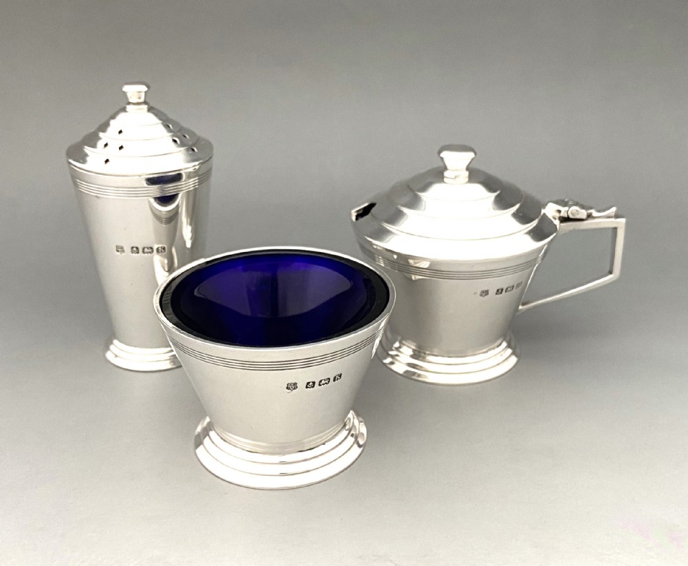 A superb silver Art Deco three piece cruet 