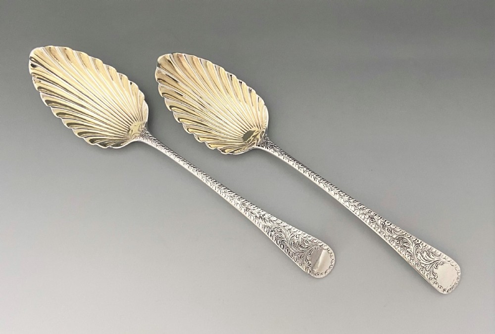 A superb pair of Georgian silver serving spoons View II