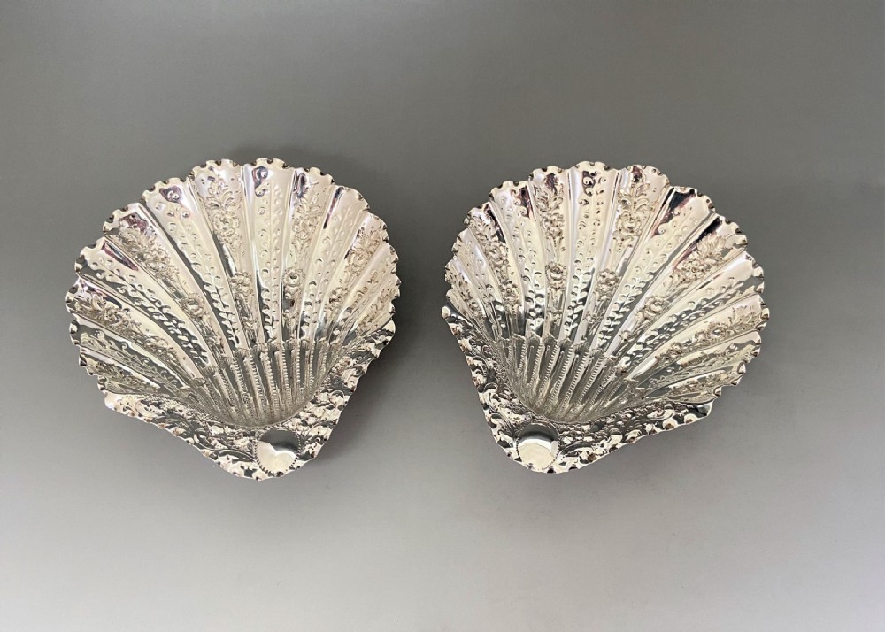 A gorgeous pair of Victorian silver butter shells