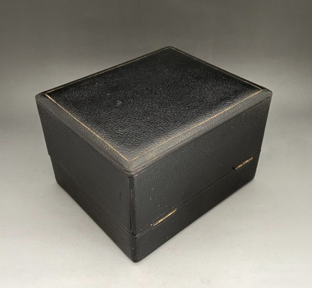 An attractive silver mounted cologne/ perfume bottle in original box View XI