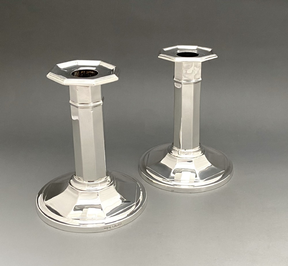 A stylish pair of George V silver candlesticks
