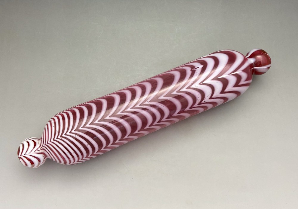 A lovely mid Victorian Nailsea glass rolling pin View VI