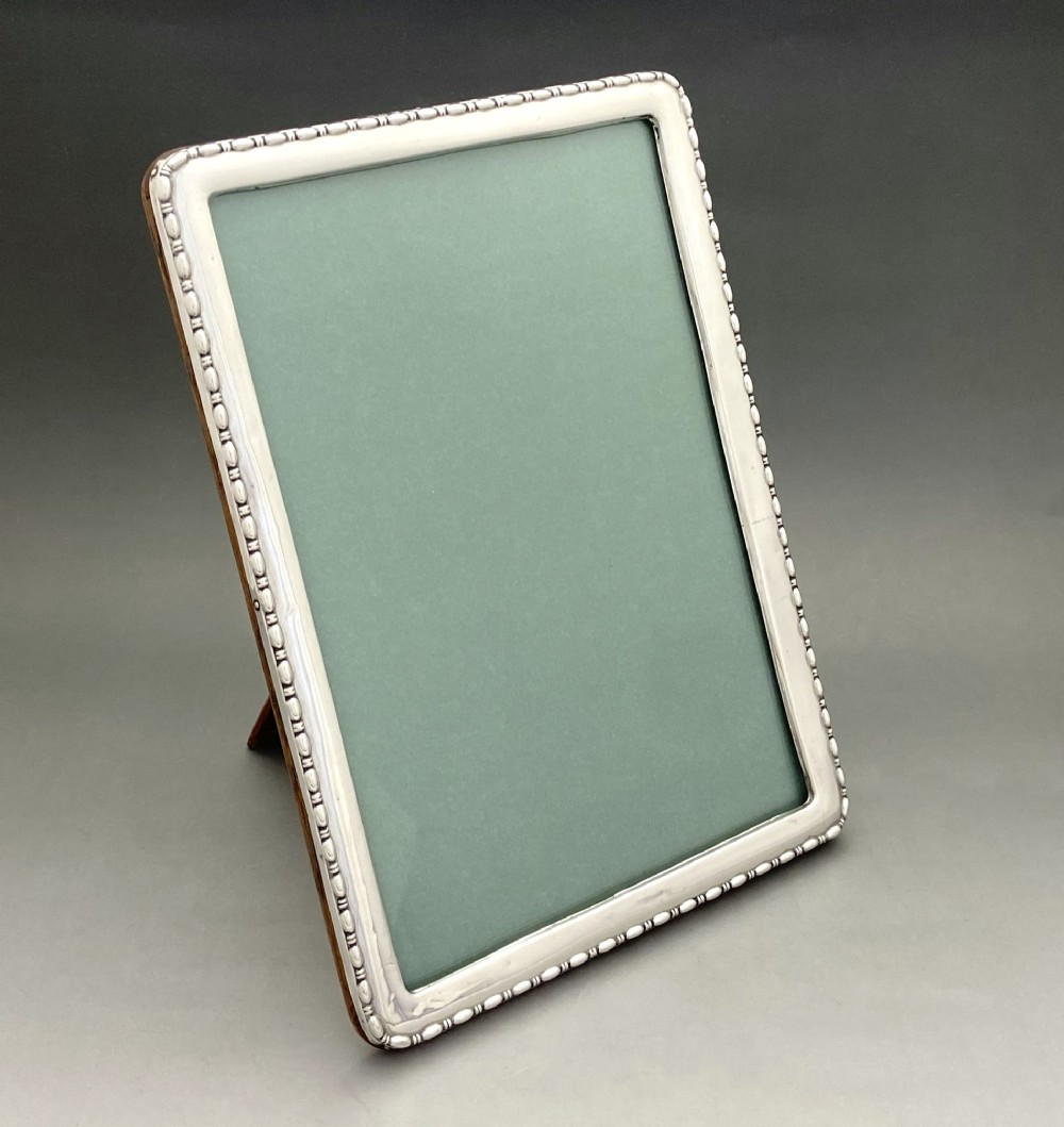 A charming George V silver photo frame