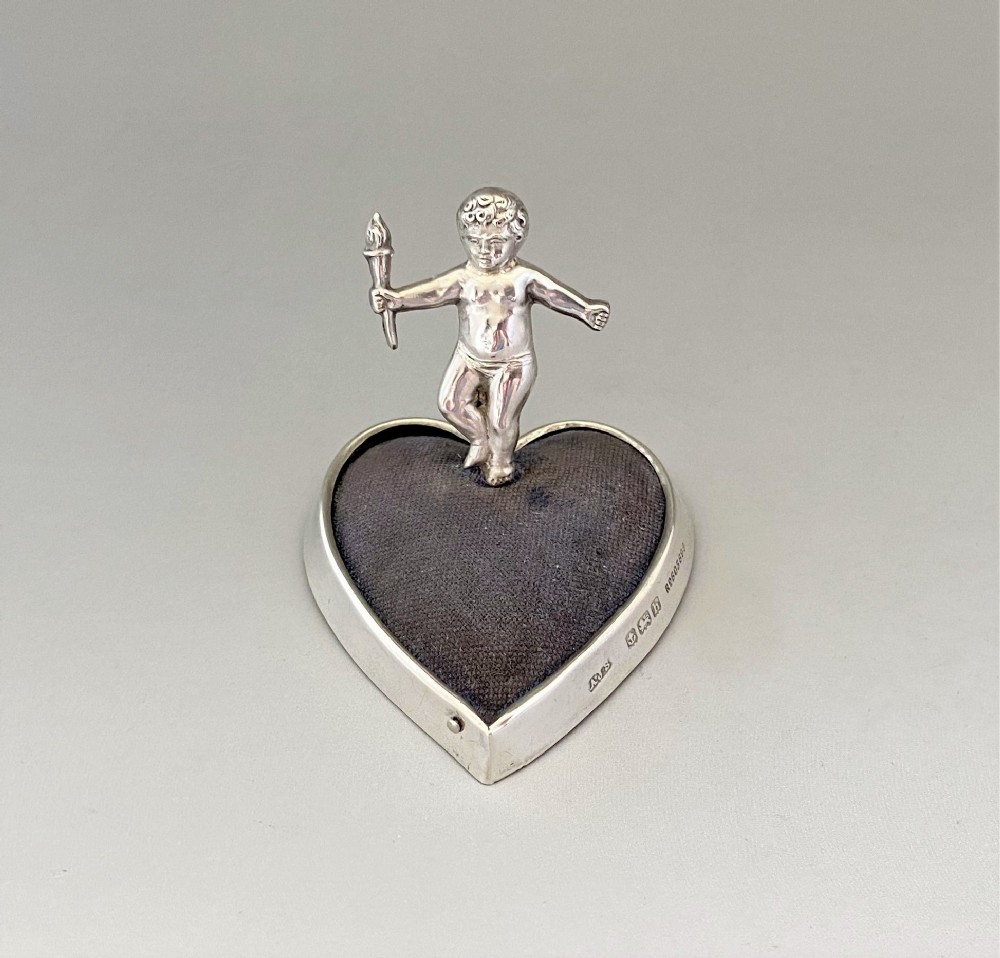 A Heart & Cherub Edwardian Silver Pin Cushion