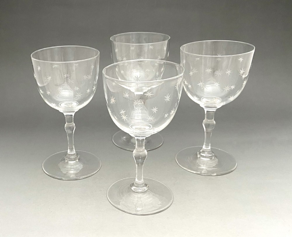 A gorgeous set of 4 Victorian star etched dessert wine glasses