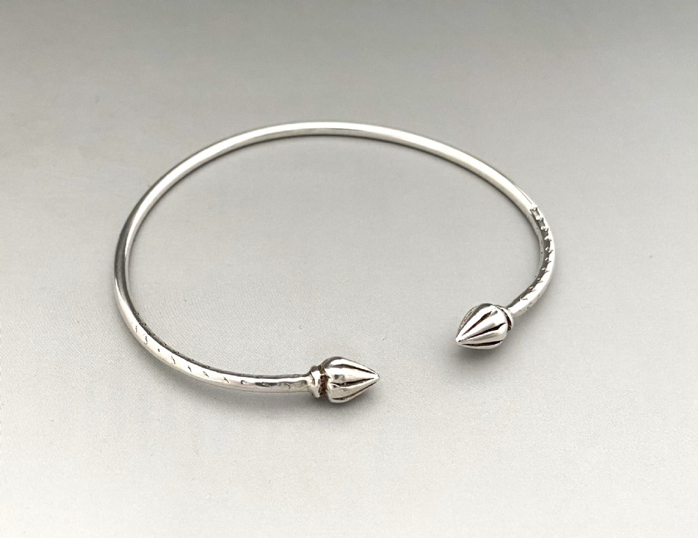 A versatile early 20th Century silver torque bangle View IV