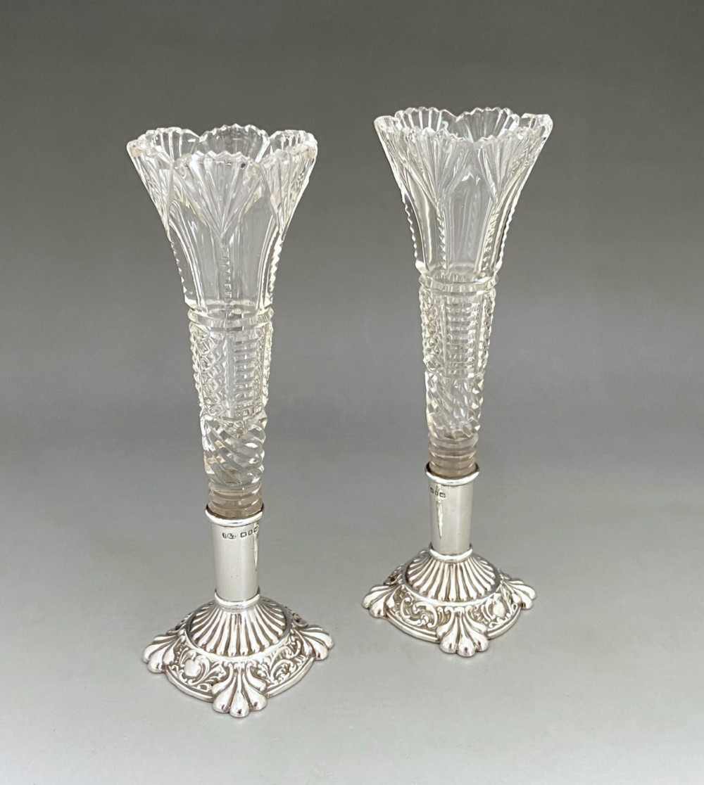 A superb pair of Victorian silver mounted bud vases