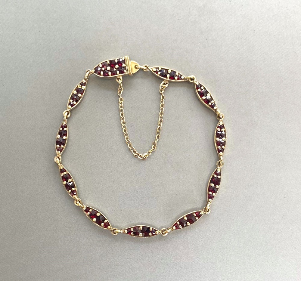 An elegant mid century silver gilt & Garnet bracelet