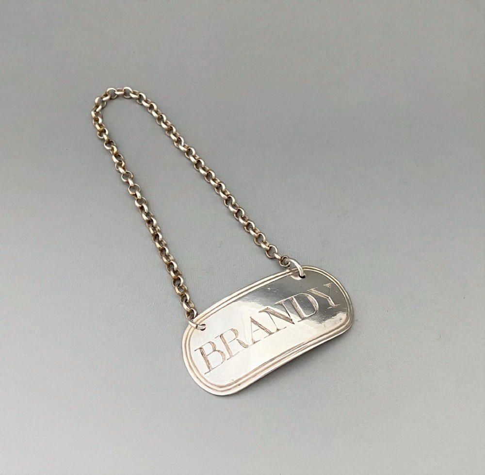 A silver Brandy label by Female silversmith - Elizabeth Morley