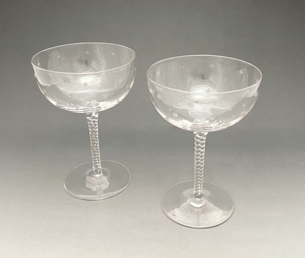 A gorgeous pair of star etched champagne glasses